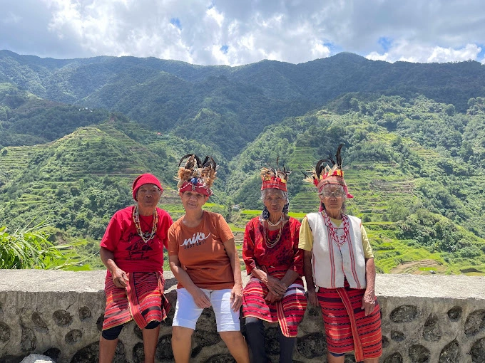 Plan Your Trip to the Stunning Banaue Rice Terraces in 2025 People in Banaue Rice Terraces by Angelica Joy Reynante
