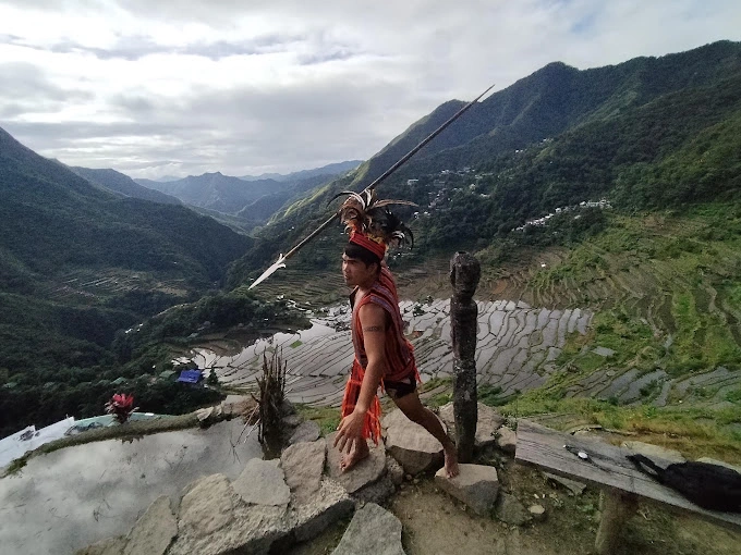 Plan Your Trip to the Stunning Banaue Rice Terraces in 2025 People in Banaue Rice Terraces by Jan Vincent Francisco